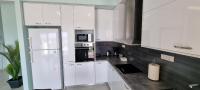 Kuchyň nebo kuchyňský kout v ubytování Sandy Cozy Apartments