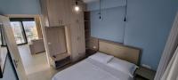 Postel nebo postele na pokoji v ubytování Sandy Cozy Apartments