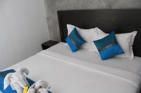 Ein Bett oder Betten in einem Zimmer der Unterkunft B Happy Resort - SHA ExtraPlus