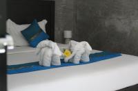Ein Bett oder Betten in einem Zimmer der Unterkunft B Happy Resort - SHA ExtraPlus