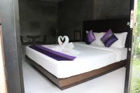 Ein Bett oder Betten in einem Zimmer der Unterkunft B Happy Resort - SHA ExtraPlus
