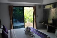 Ein Bett oder Betten in einem Zimmer der Unterkunft B Happy Resort - SHA ExtraPlus