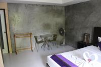 Ein Bett oder Betten in einem Zimmer der Unterkunft B Happy Resort - SHA ExtraPlus