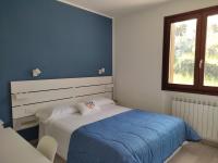 Posteľ alebo postele v izbe v ubytovaní IseoLakeRental - Costa del Sole