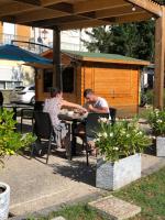 a man and a woman playing a game at a table at Grand hôtel de l&#39;Europe in Vals-les-Bains