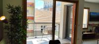 a balcony with a view of a building at Le Cosy green - Appart 3ch + balcon - neuf in Saint Etienne