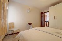 A bed or beds in a room at Stella del Garda 2 con terrazza