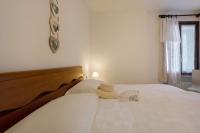 A bed or beds in a room at Stella del Garda 2 con terrazza