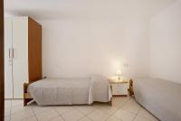 A bed or beds in a room at Stella del Garda 2 con terrazza