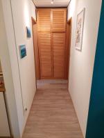 a hallway with a wooden door in a house at Ferienwohnung am Walchensee in Walchensee