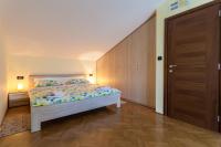 Łóżko lub łóżka w pokoju w obiekcie Apartments Lily