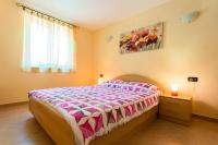 Łóżko lub łóżka w pokoju w obiekcie Apartments Lily