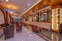 a bar with chairs and tables in a restaurant at Lake River Side Hotel Spa in Side