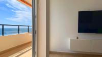 A television and/or entertainment centre at BEACHFRONT -- NEW LUXURY Apartment -- 1ª Linea Playa -- Fuengirola CITY CENTER -- Private PARKING -- Panoramic Sea Views --