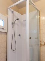 a shower with a glass door in a bathroom at Le Petit Mondi in Mareuil-sur-Cher