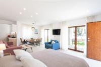 A television and/or entertainment centre at Villa Dafni - Infinite Sea Vistas with Private Pool