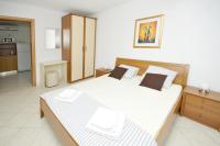 Posteľ alebo postele v izbe v ubytovaní Apartments Villa Moonlight