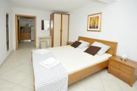 Posteľ alebo postele v izbe v ubytovaní Apartments Villa Moonlight