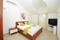 Posteľ alebo postele v izbe v ubytovaní Apartments Villa Moonlight