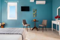 TV a/nebo společenská místnost v ubytování Evi Boutique Rooms
