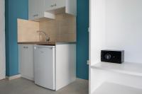 Kuchyň nebo kuchyňský kout v ubytování Evi Boutique Rooms