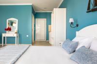 Postel nebo postele na pokoji v ubytování Evi Boutique Rooms