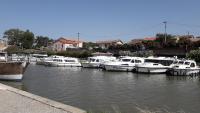 a bunch of boats are docked in a harbor at Le Midi 2 in Trèbes