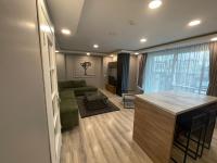 A television and/or entertainment centre at On4 Rooms & Suites