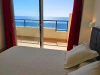 A bed or beds in a room at BEACHFRONT -- NEW LUXURY Apartment -- 1ª Linea Playa -- Fuengirola CITY CENTER -- Private PARKING -- Panoramic Sea Views --