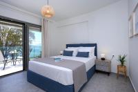 Posteľ alebo postele v izbe v ubytovaní ALMYRA seafront residence