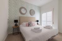 Posteľ alebo postele v izbe v ubytovaní Thyssen Boutique Apartments by Caleta Homes