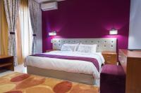 A bed or beds in a room at Hotel Aggelos Kefalonia