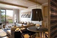 a living room with a couch and a table at Jumeirah Muscat Bay Oman in Muscat