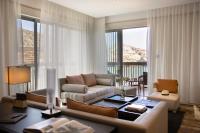 a living room with a couch and a table at Jumeirah Muscat Bay Oman in Muscat