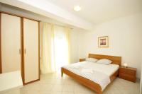 Posteľ alebo postele v izbe v ubytovaní Apartments Villa Moonlight