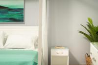 A bed or beds in a room at ''Meraviglia casa'' Irida apartment
