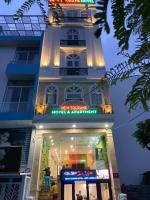 a building with a sign that reads new yorker hotel apartments at New Tourane Hotel in Danang