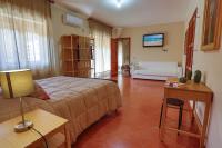 A bed or beds in a room at B&B CasaBuddace