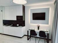 TV a/nebo společenská místnost v ubytování Apartamenty na Spokojnej