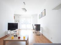 Televízia a/alebo spoločenská miestnosť v ubytovaní Waw Apartamenty Wilanów Branickiego