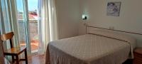Postel nebo postele na pokoji v ubytování Hotel Grove