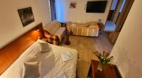 a room with a bed and a living room at Restaurant &amp; rooms Visovac - best value in Skradin