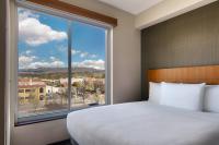 a bedroom with a large bed and a large window at Hyatt Place Boise/Downtown in Boise