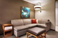 a living room with a couch and a table at Hyatt Place Boise/Downtown in Boise