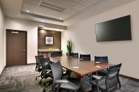 a conference room with a wooden table and chairs at Hyatt Place Boise/Downtown in Boise