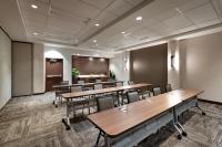a conference room with wooden tables and chairs at Hyatt Place Boise/Downtown in Boise