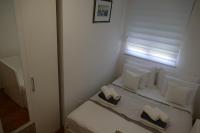 Posteľ alebo postele v izbe v ubytovaní Seafront City Apartment Ana Trogir