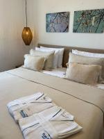 Łóżko lub łóżka w pokoju w obiekcie Portobello Boutique Hotel