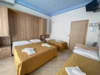 Posteľ alebo postele v izbe v ubytovaní Hotel Nanni Garnì