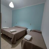 A bed or beds in a room at Hotel Villa Alberta B&B